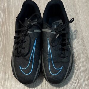 Nike Black Soccer Cleats With Blue Swoosh